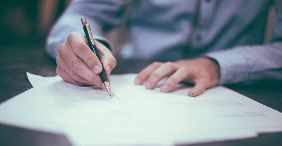 Cairns Accountant signing documents